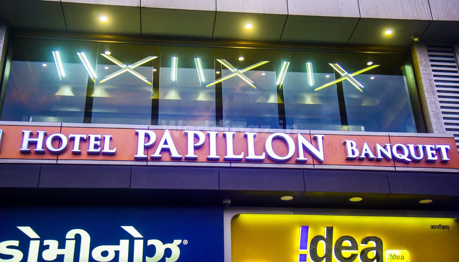 Hotel Papillon illuminated signage at night